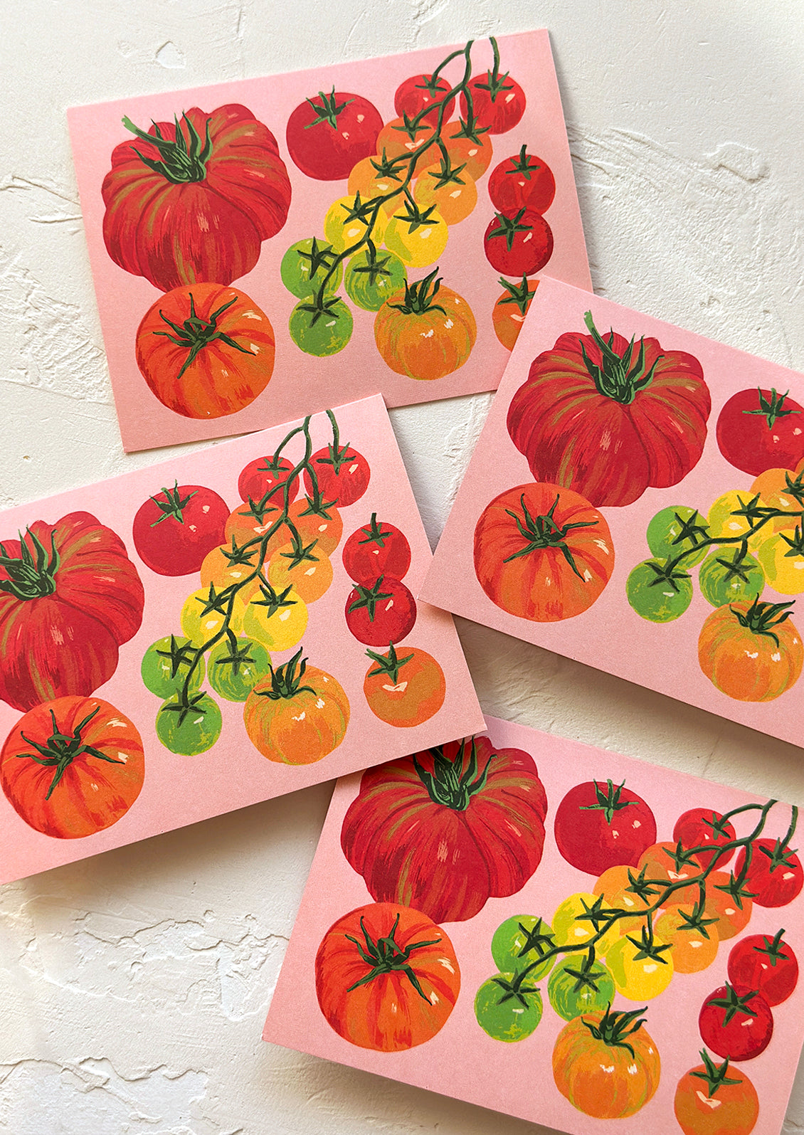 A set of pink tomato printed greeting cards.