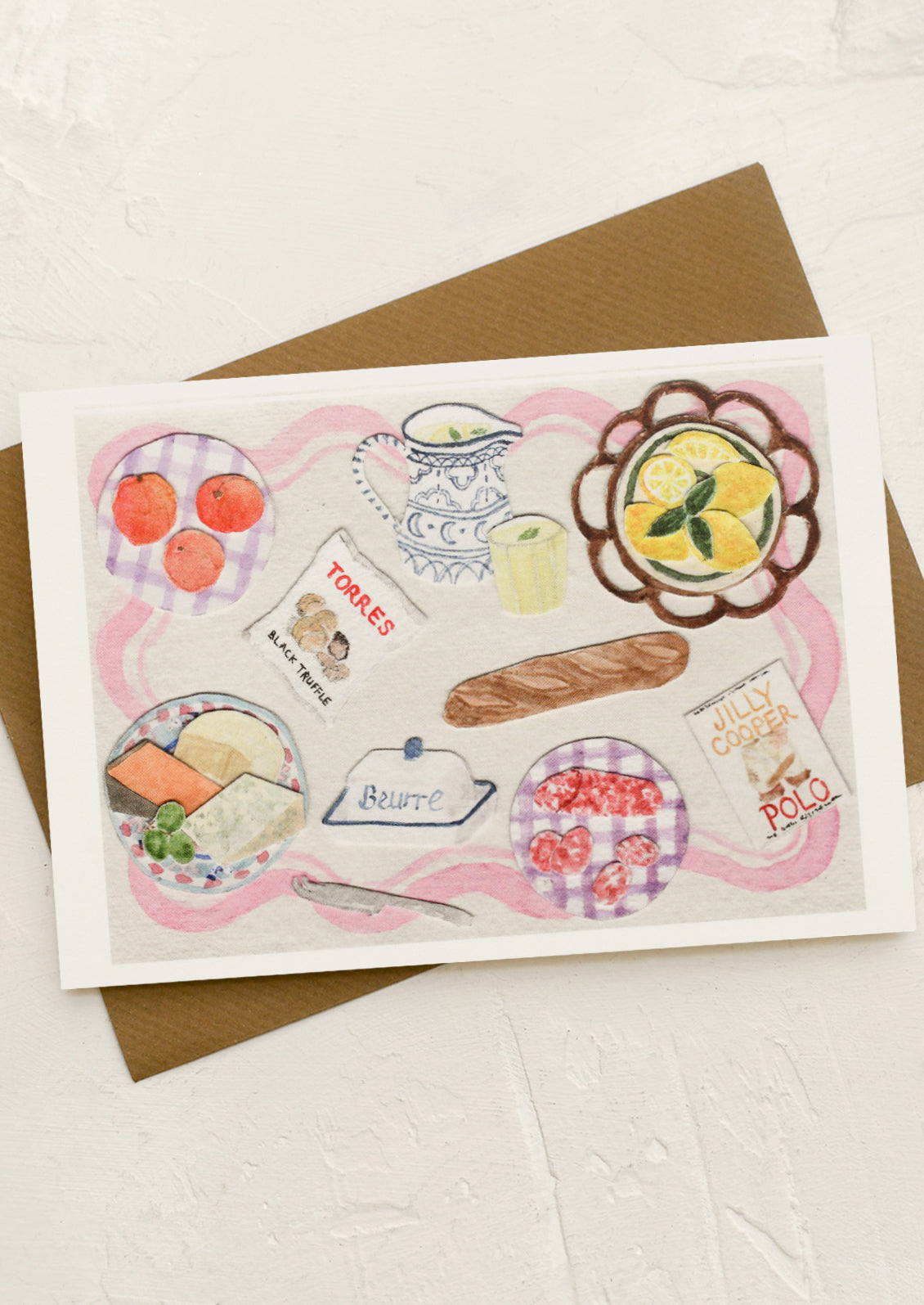 A greeting card with collage still life scene of picnic items.