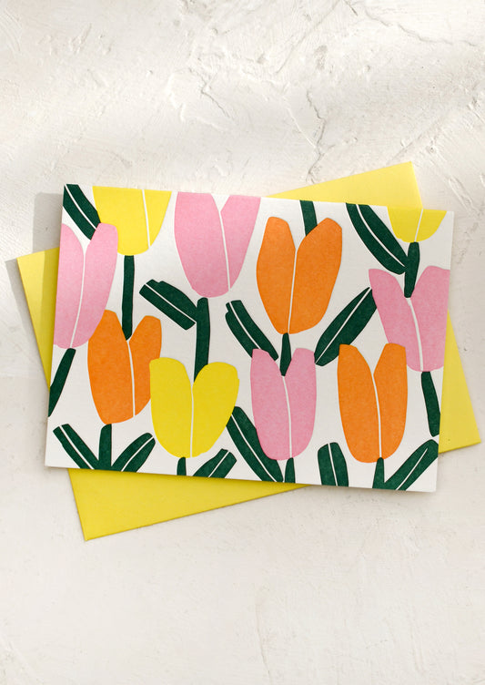 Card with pink, orange and yellow letterpress tulip pattern.