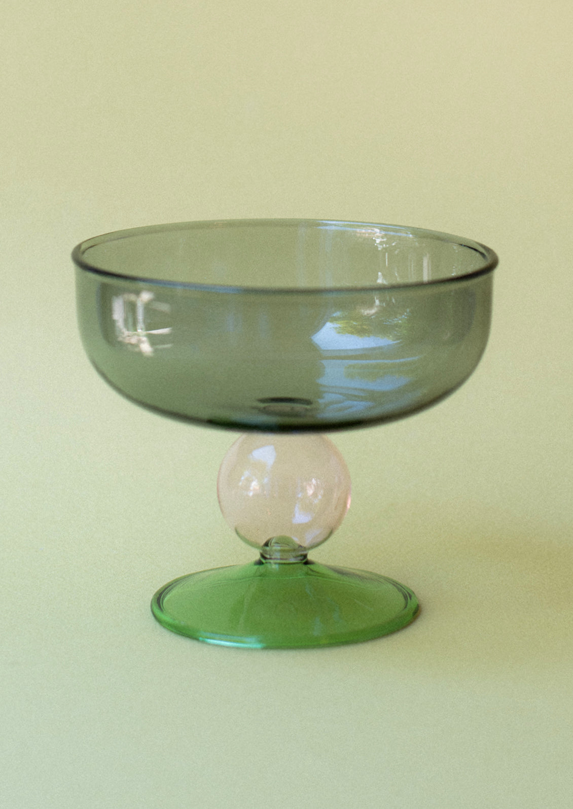 A colorful couple glasses with modern shape in grey, pink and green.