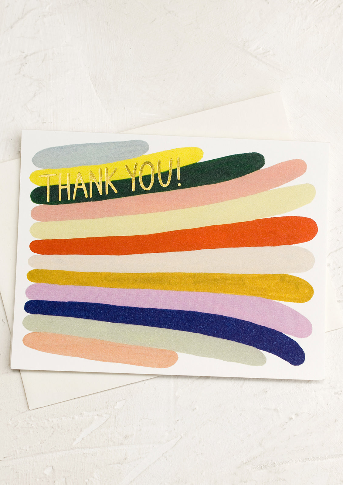 A colorful thank you card with stripe pattern.