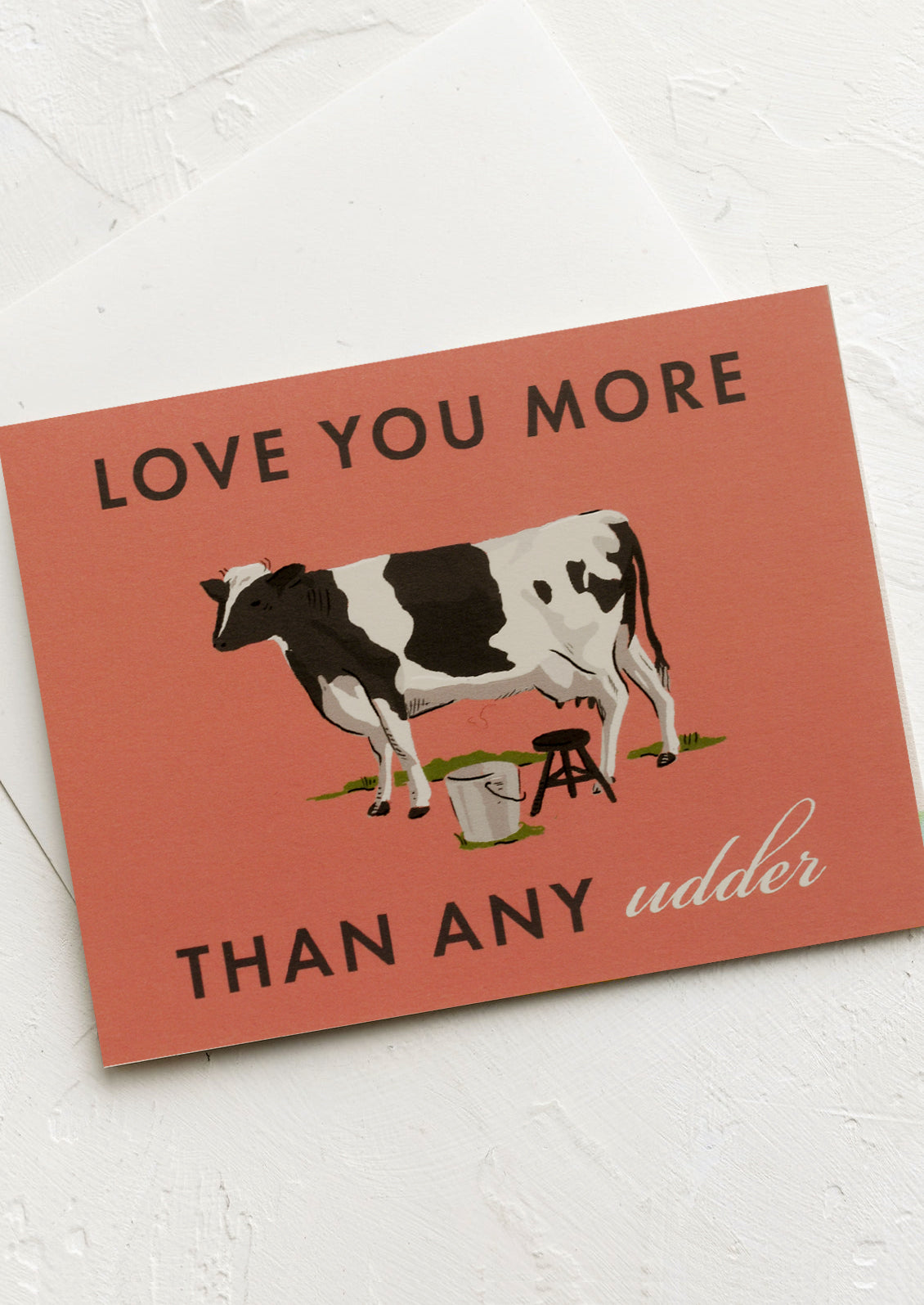 A cow print card reading "Love you more than any udder".