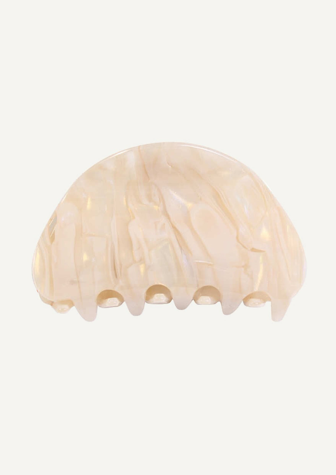 A curved hair claw in cream pearlized marble.