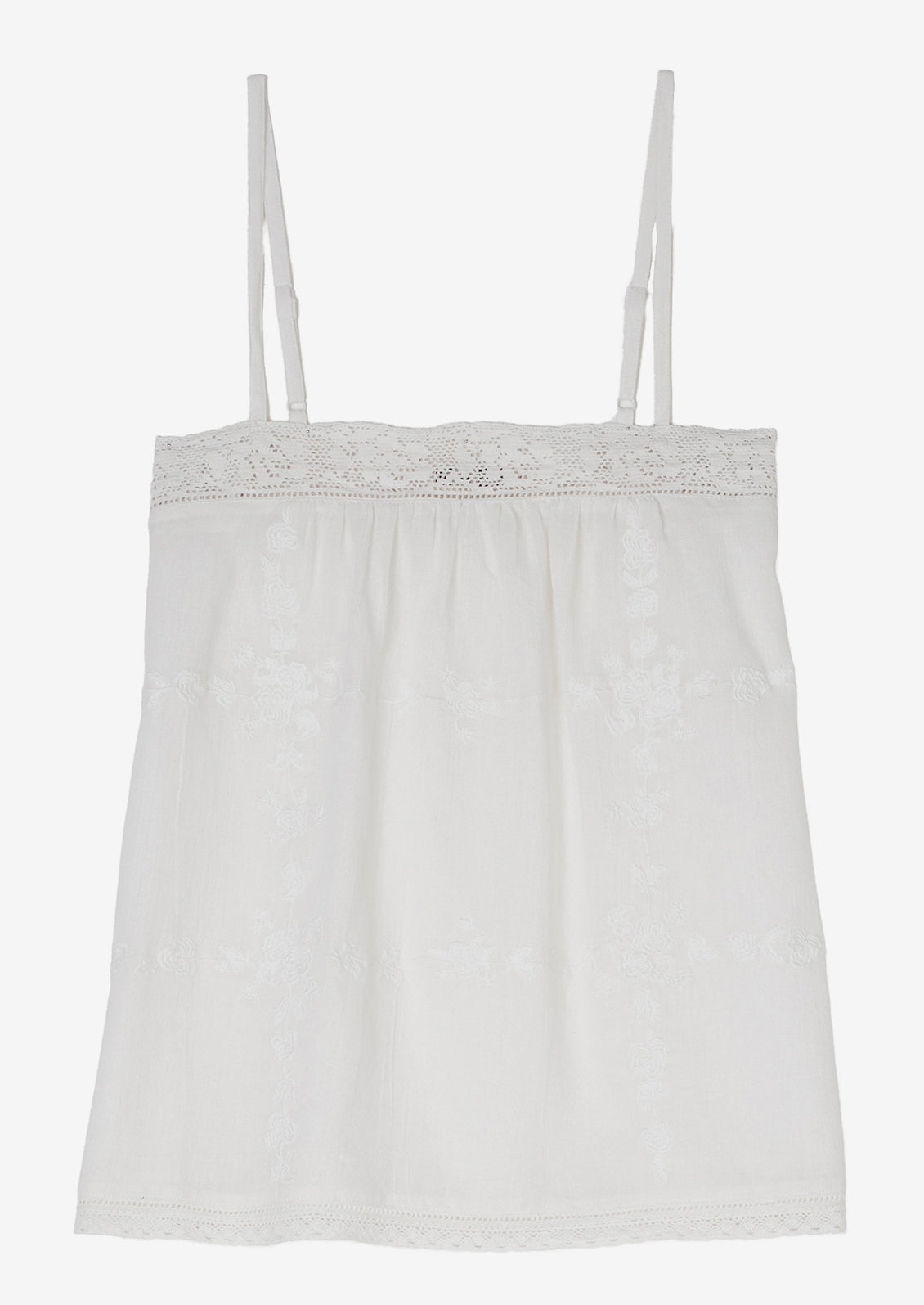 A white cami with tonal floral embroidery.