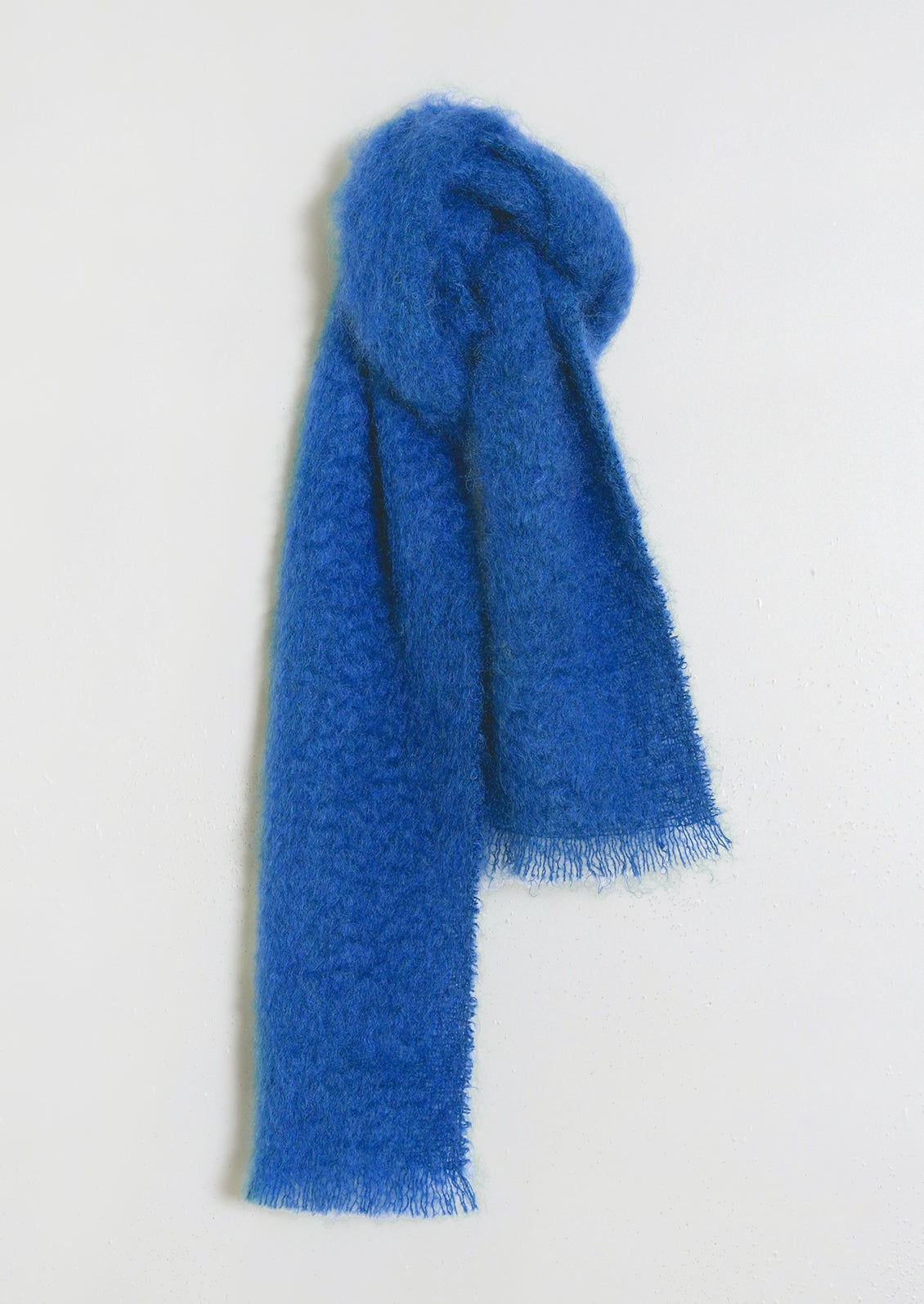 A fuzzy mohair scarf in cobalt blue.