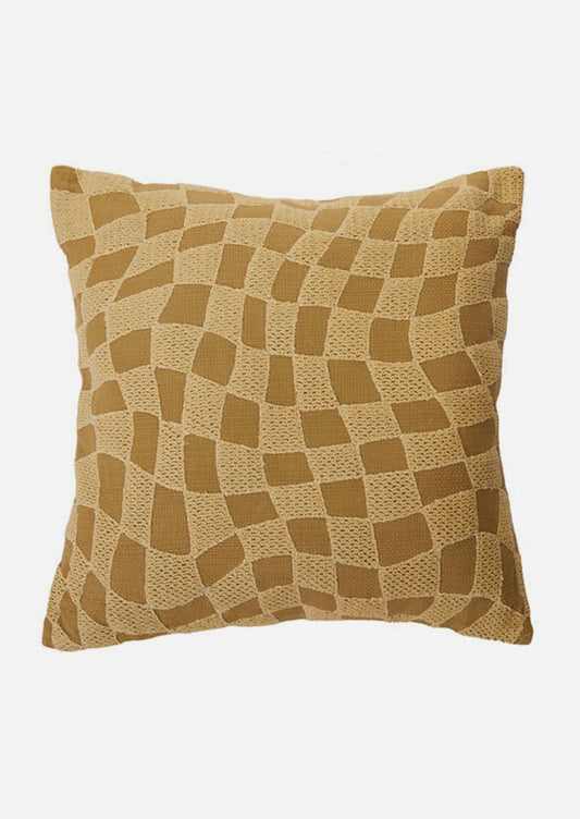 A throw pillow with embroidered tonal checker pattern.