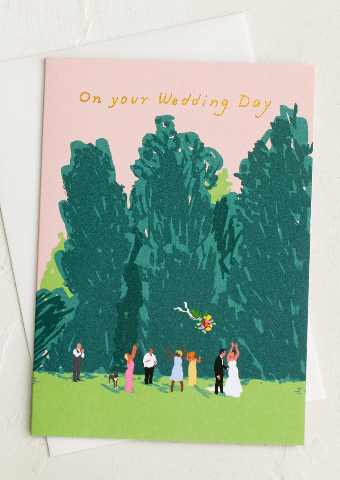 A greeting card with illustration of friends at a wedding, text reads "On Your Wedding Day".