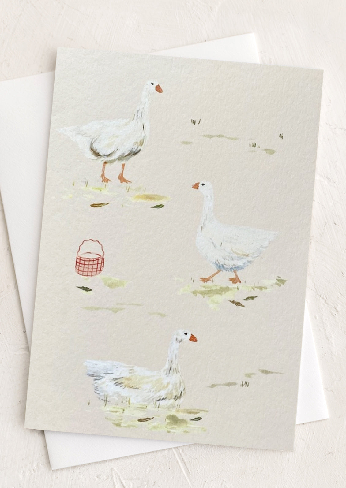 A greeting card illustrated with white geese.