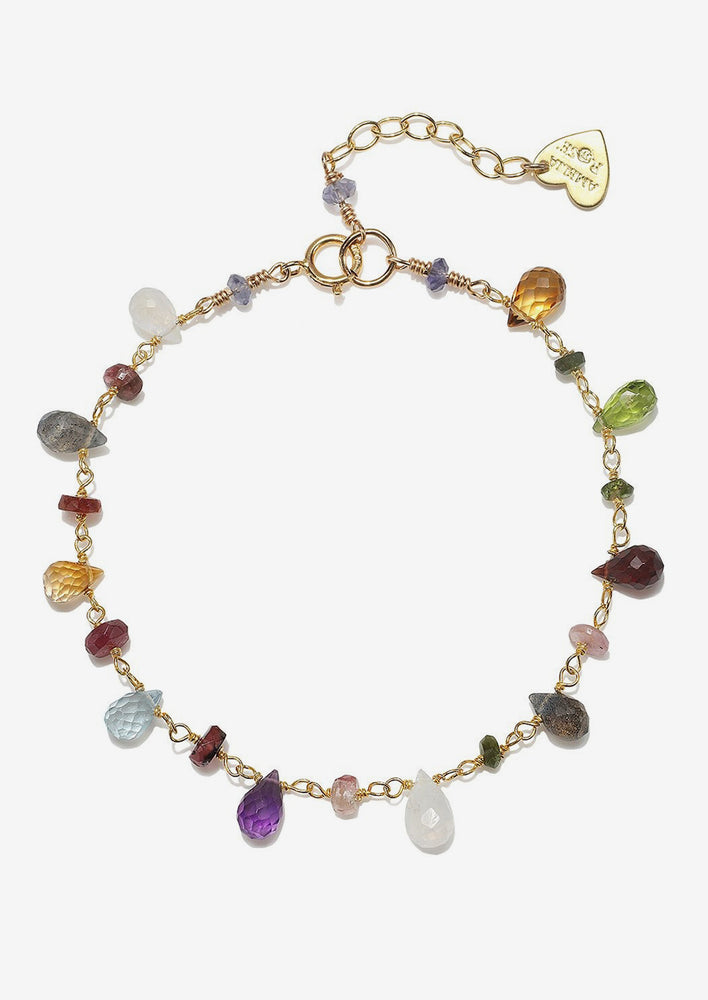 A gold bracelet with mixed color gemstones in teardrops and rondelle shape beads.