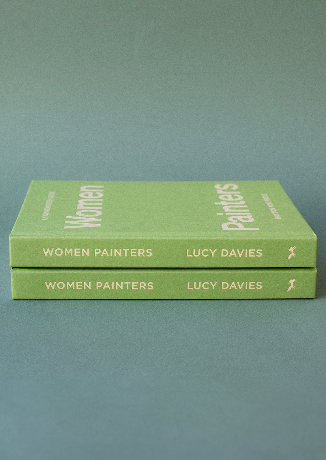 A green hardcover book with yellow lettering titled "An Opinionated Guide To Women Painters".