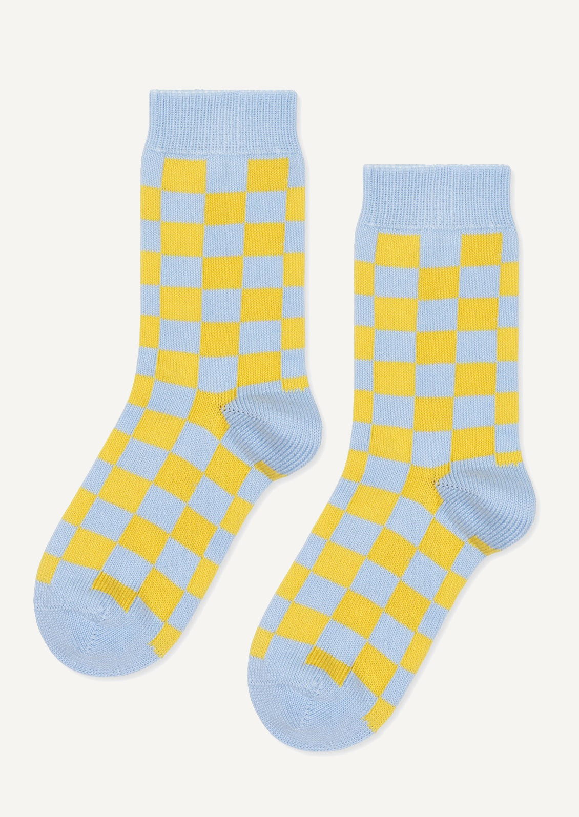 A pair of socks in sky blue and yellow checker.