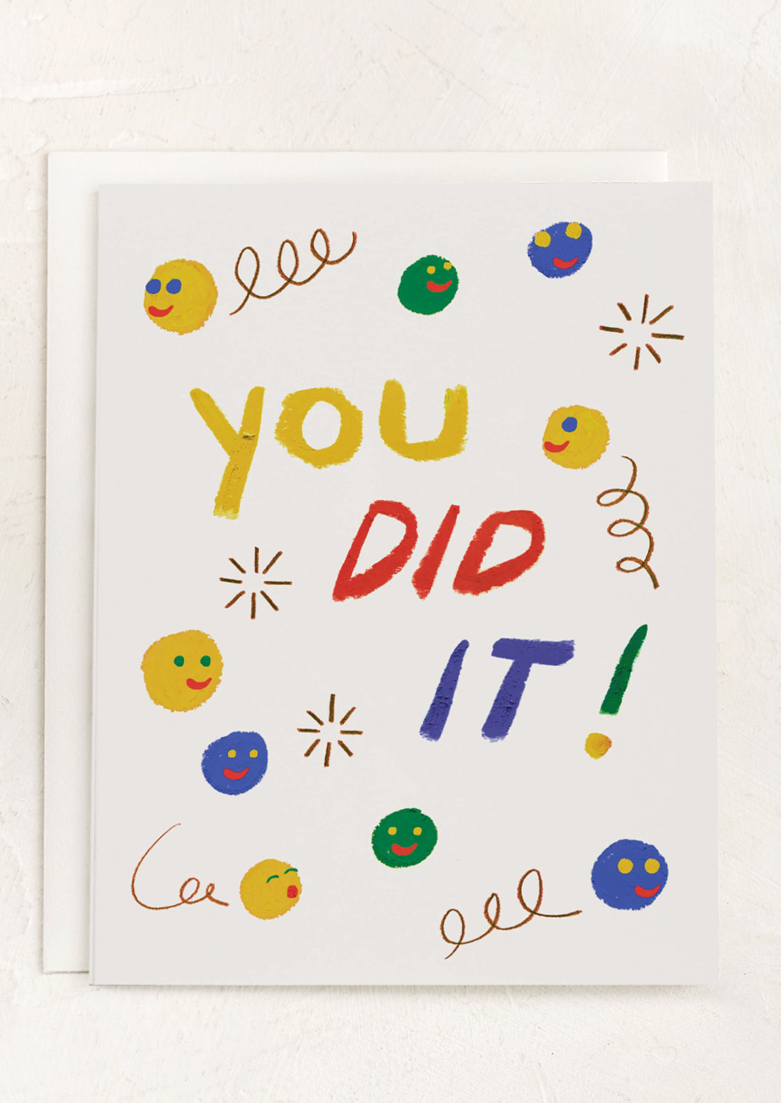 A smiley face print card, text reads "You Did It!".