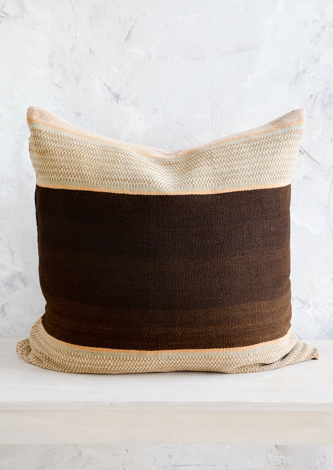 Throw pillow made from vintage wool fabric in brown and beige