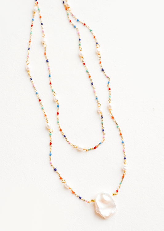 Delicate, layered 2-strand necklace with rainbow colored beads on fine gold chain, pearl pendant at center