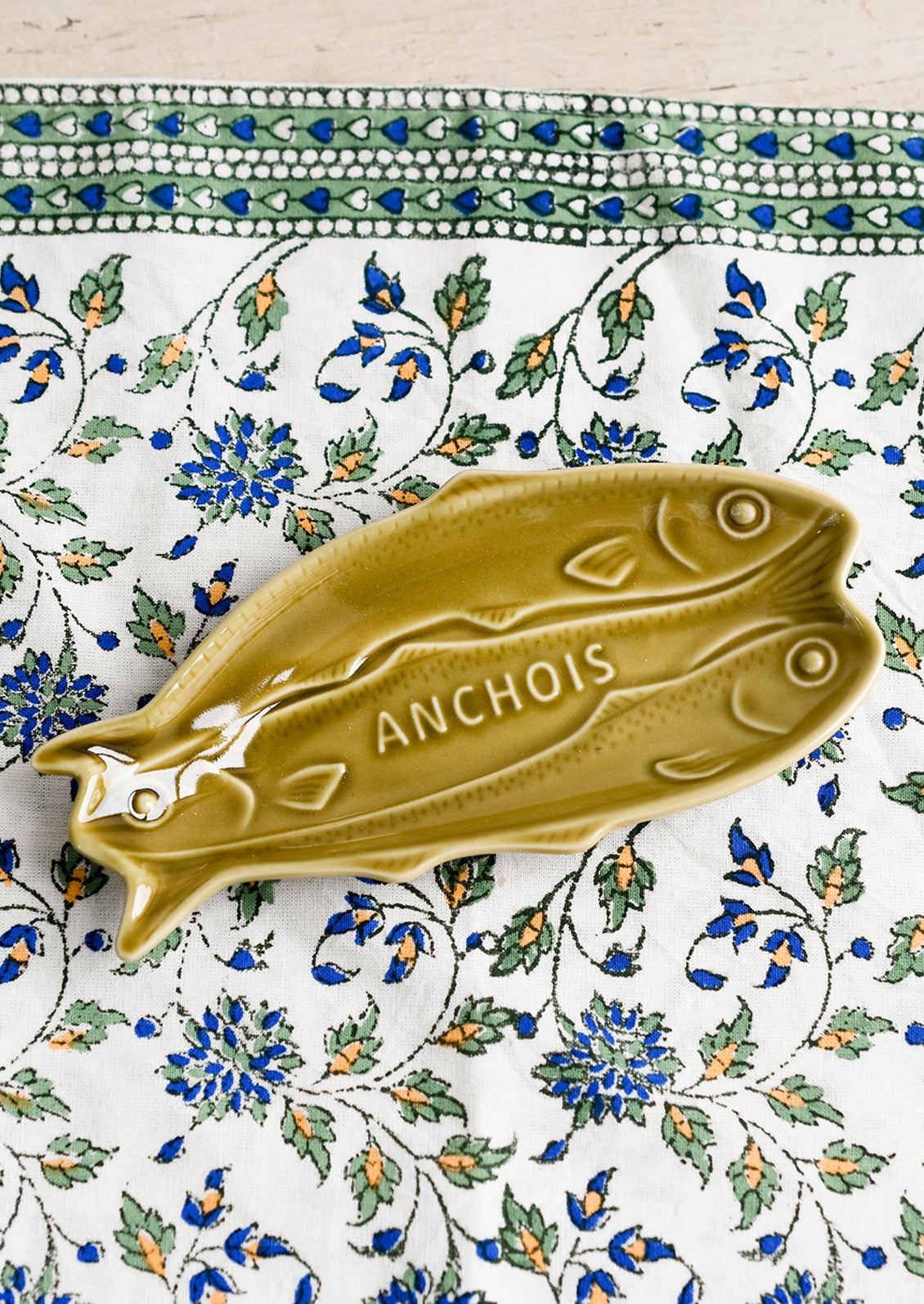 Yellow-green ceramic sardines dish.