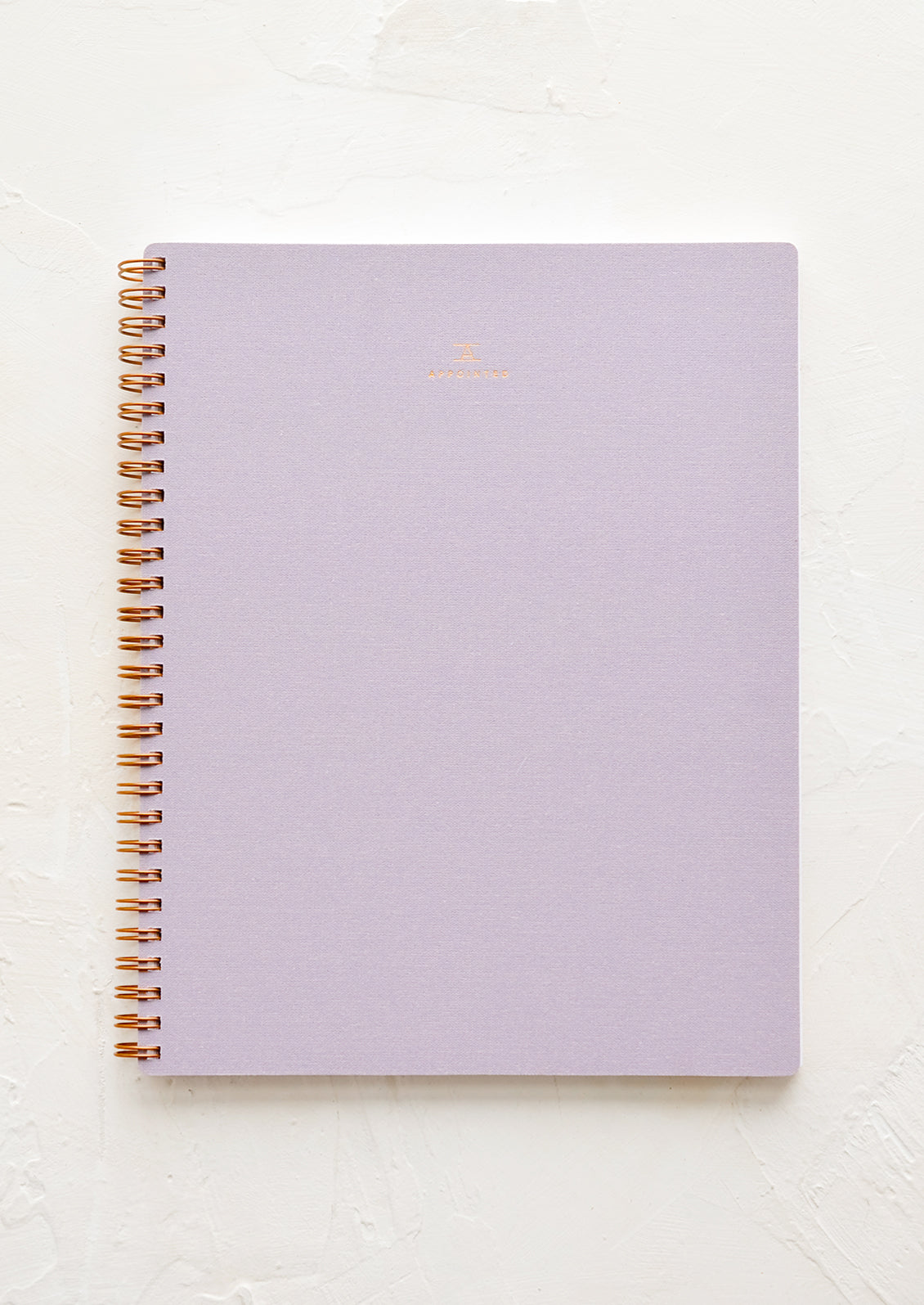 A spiral bound notebook in purple.