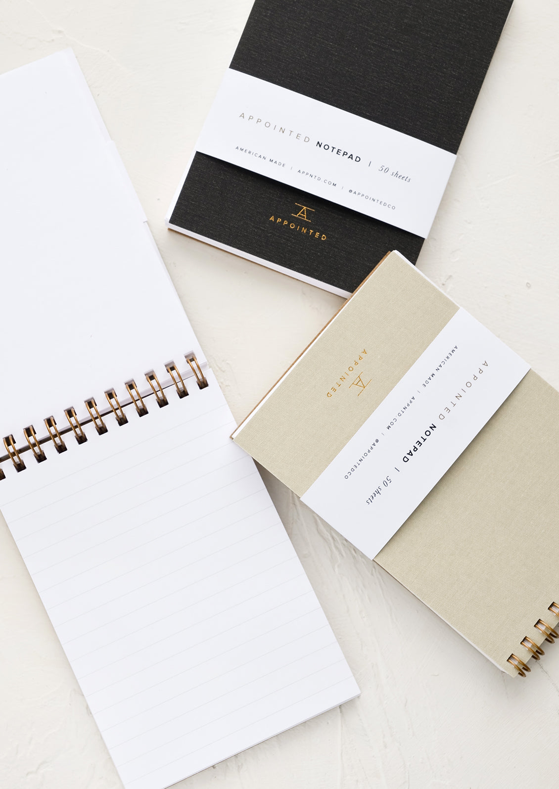 Small spiral bound notebooks with ruled pages.