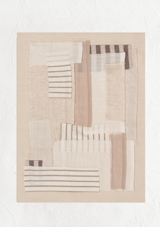 A photographic art print of layered beige fabric.