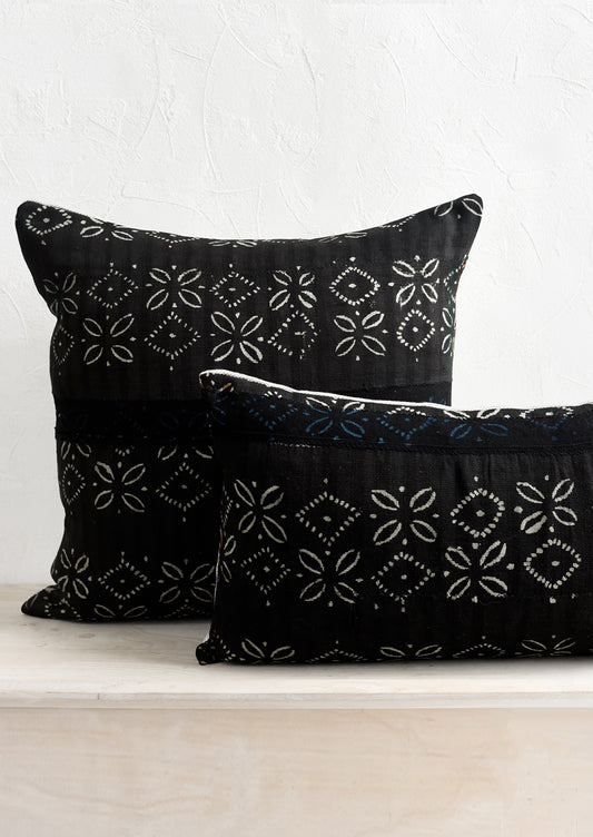 Black vintage fabric pillows in square and lumbar sizes.
