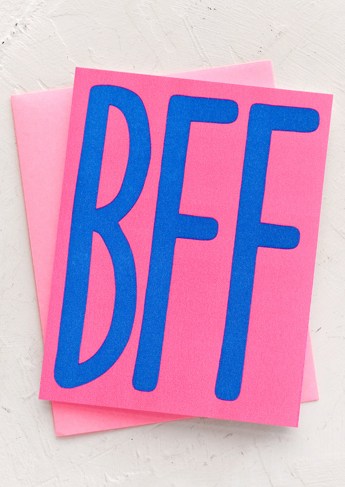 1: A neon pink card with big blue "BFF" letters.