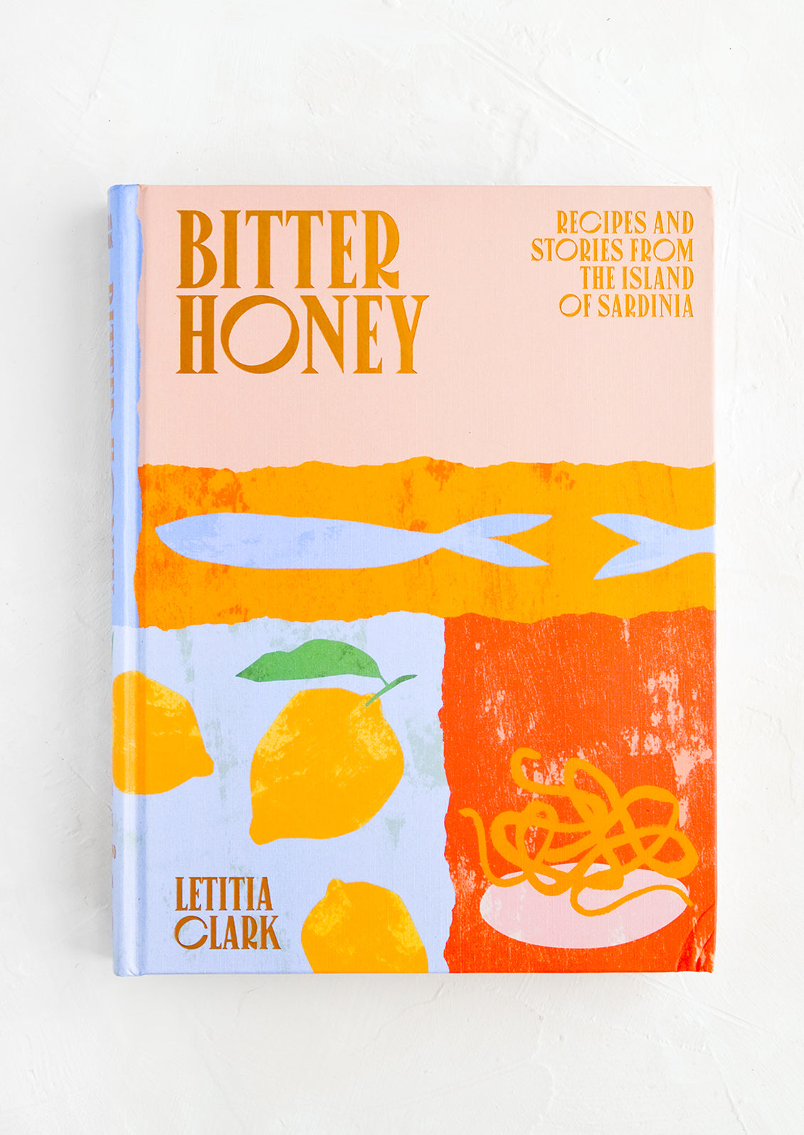 A colorful hardcover cookbook with graphic imagery.