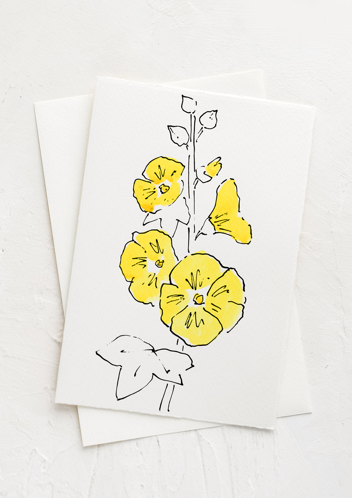 A white greeting card with a hand painted illustration of a hollyhock flower.