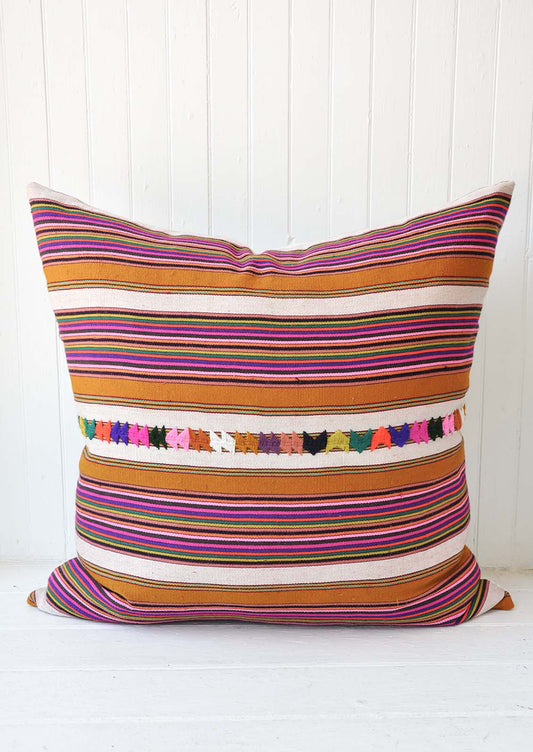 A multi-colored stripe pillow.