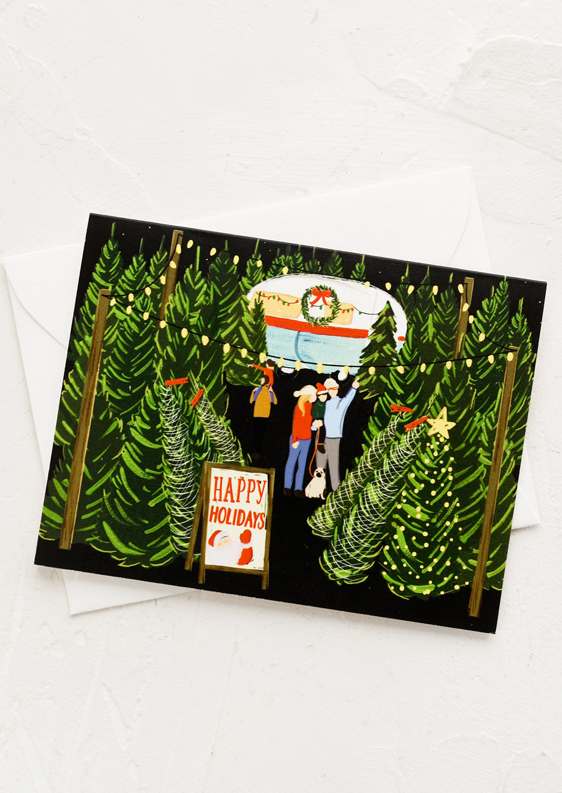 A greeting card with illustration of family shopping for a Christmas tree.
