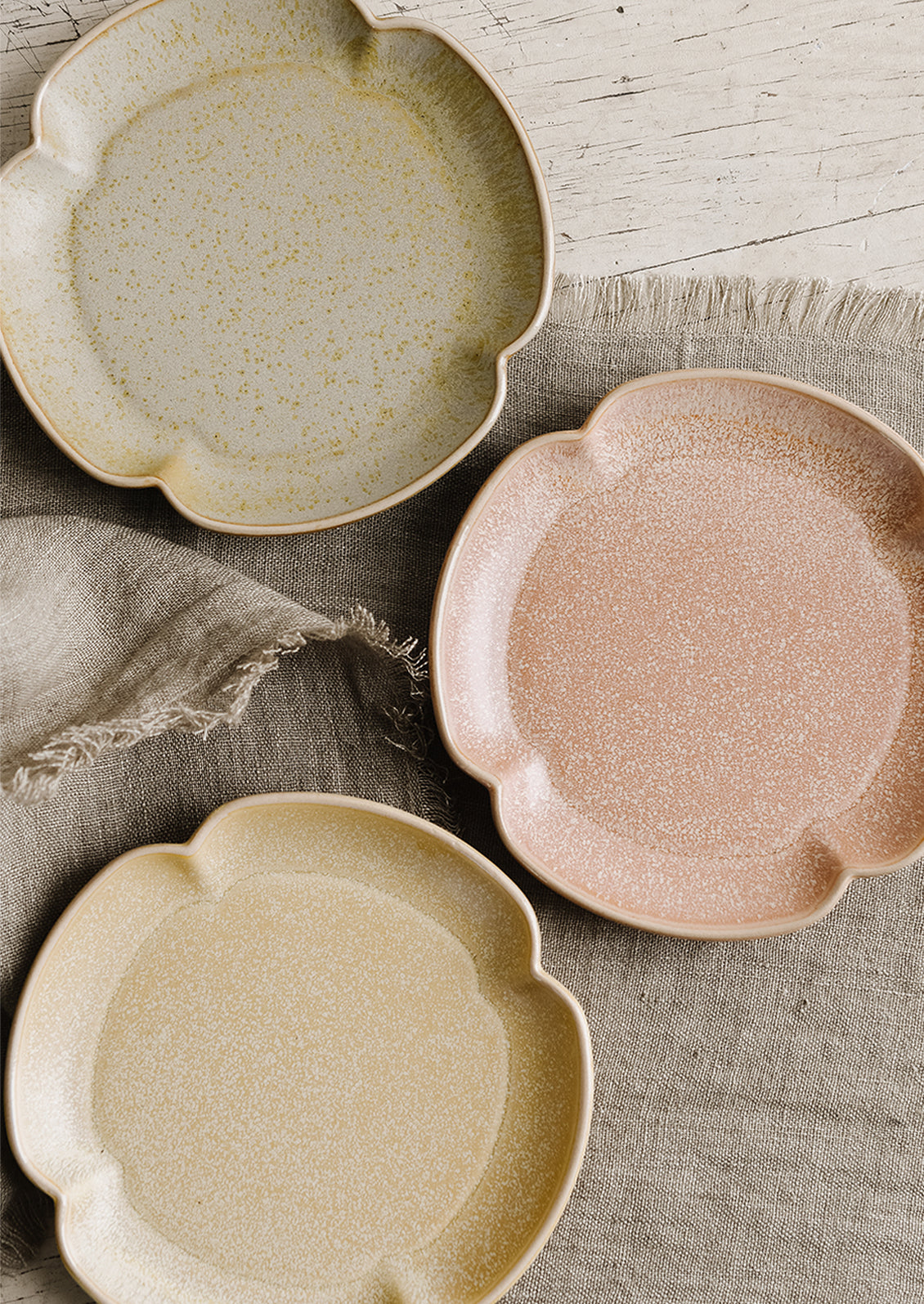 Quatrefoil shaped plates in three colors.