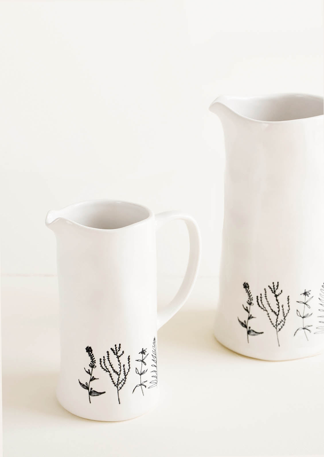 Tall Ceramic Pitchers in White with Black Botanical Drawings, Shown in 2 Sizes - LEIF