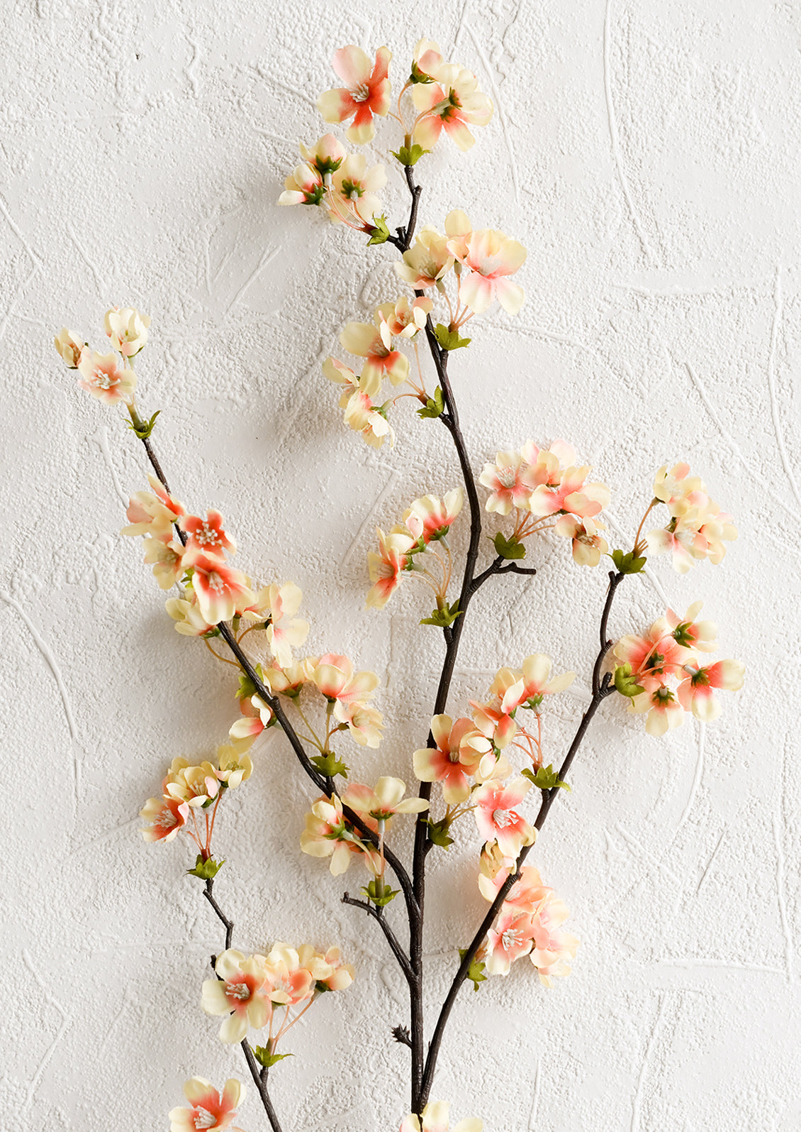 A faux plum blossom spray.