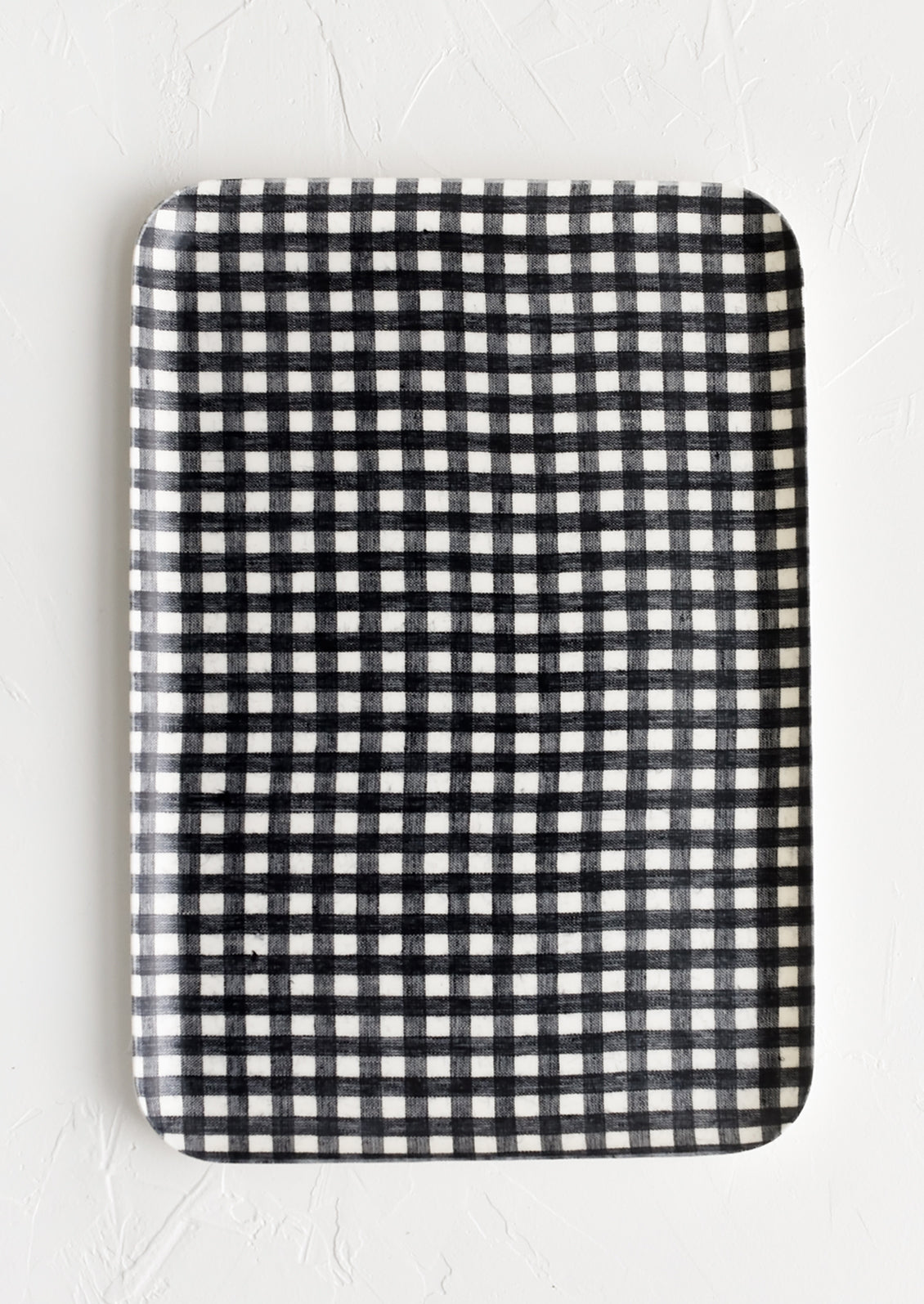 A large tray in black and white gingham print.