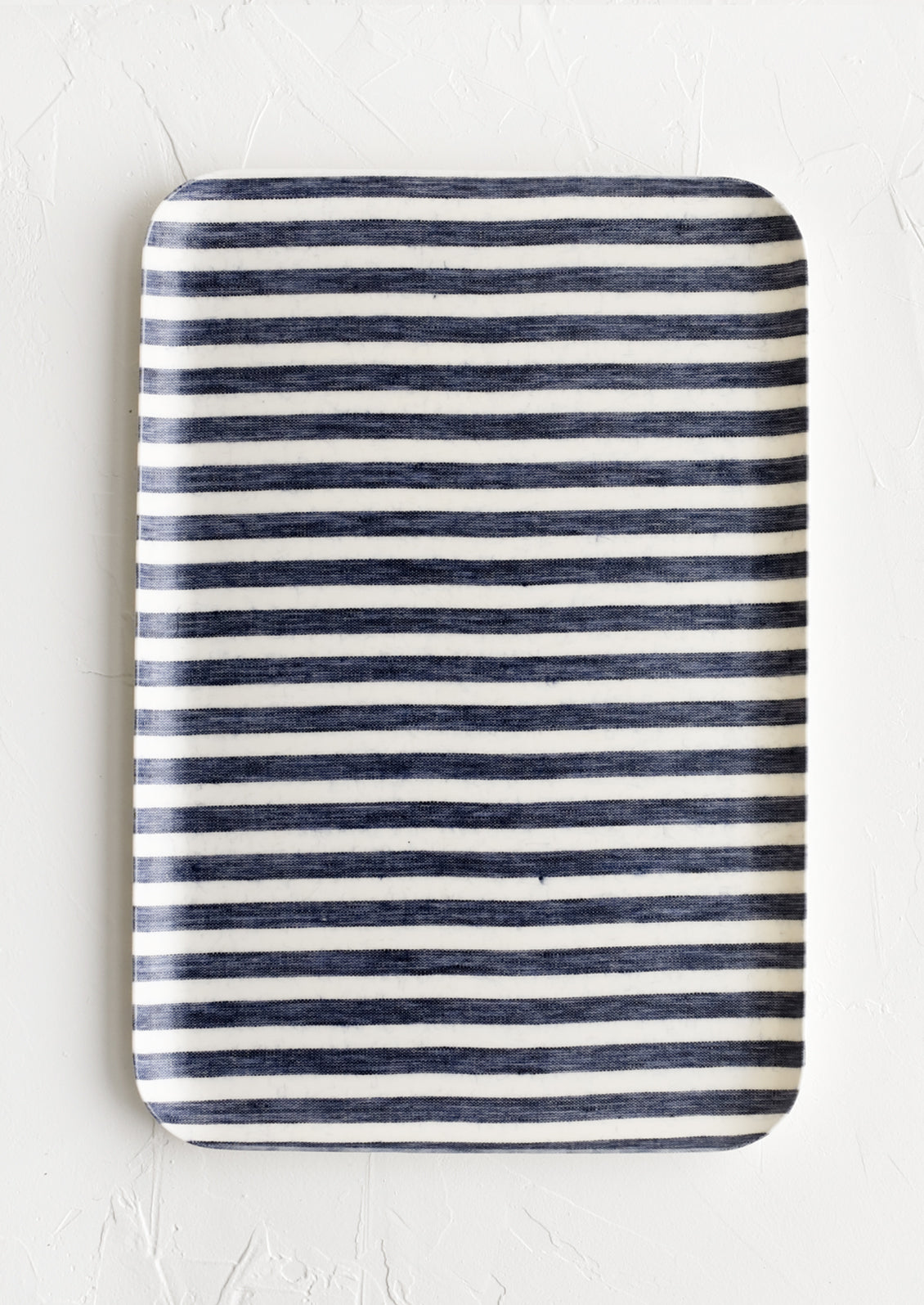 A large tray in denim and white wide stripe.