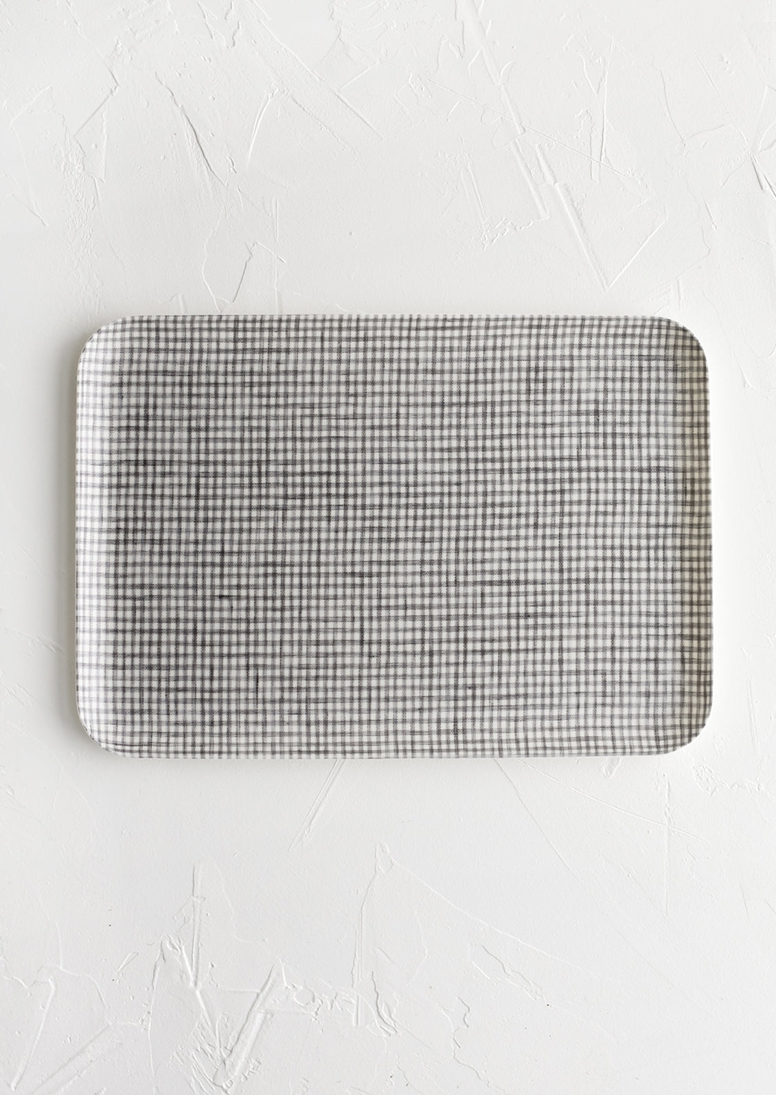 A small tray in grey and white mini gingham.