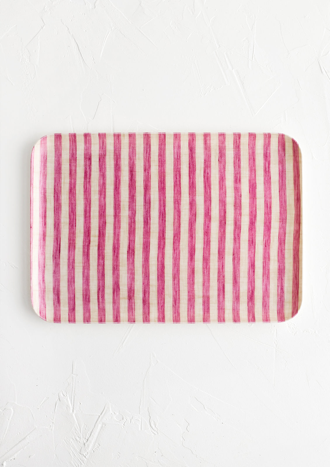 A small tray in pink and cream stripe.