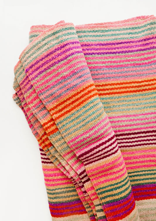 Vintage wool textile in thin, brightly multi-colored striped pattern