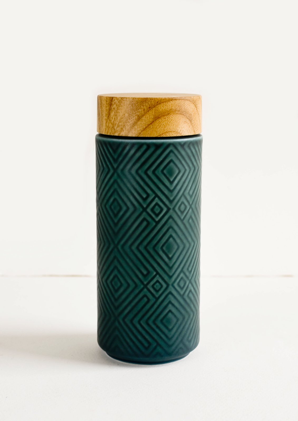 Geometric textured ceramic tall travel tumbler in peacock green with bamboo lid