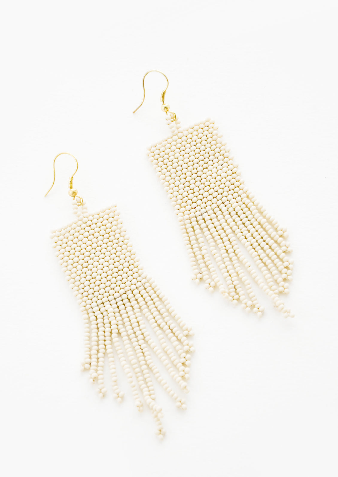 Ivory rectangular taper fringe beaded earrings.