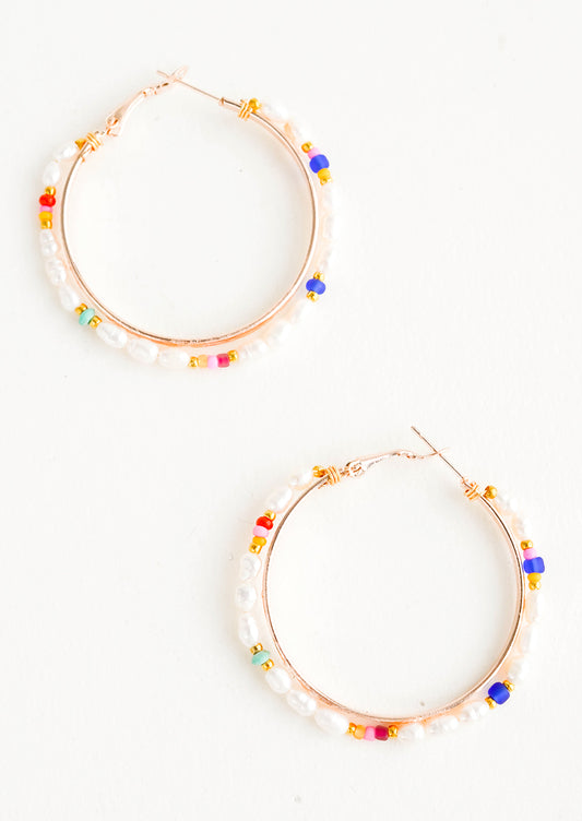 Round hoop earrings with beaded outer layer of pearls and colored glass seed beads and rosegold inner hoop