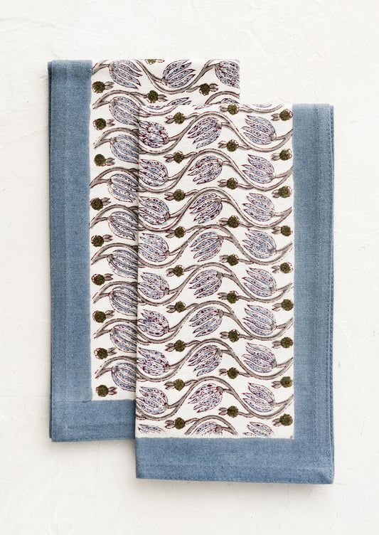 Floral print napkins with dusty blue border.