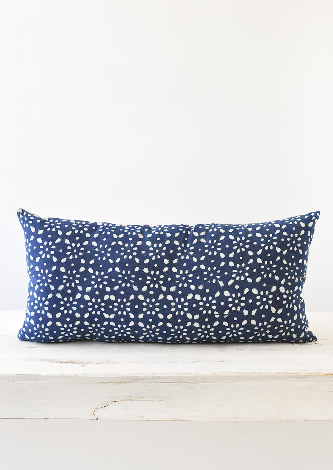 A 12x24 indigo and white block printed pillow.