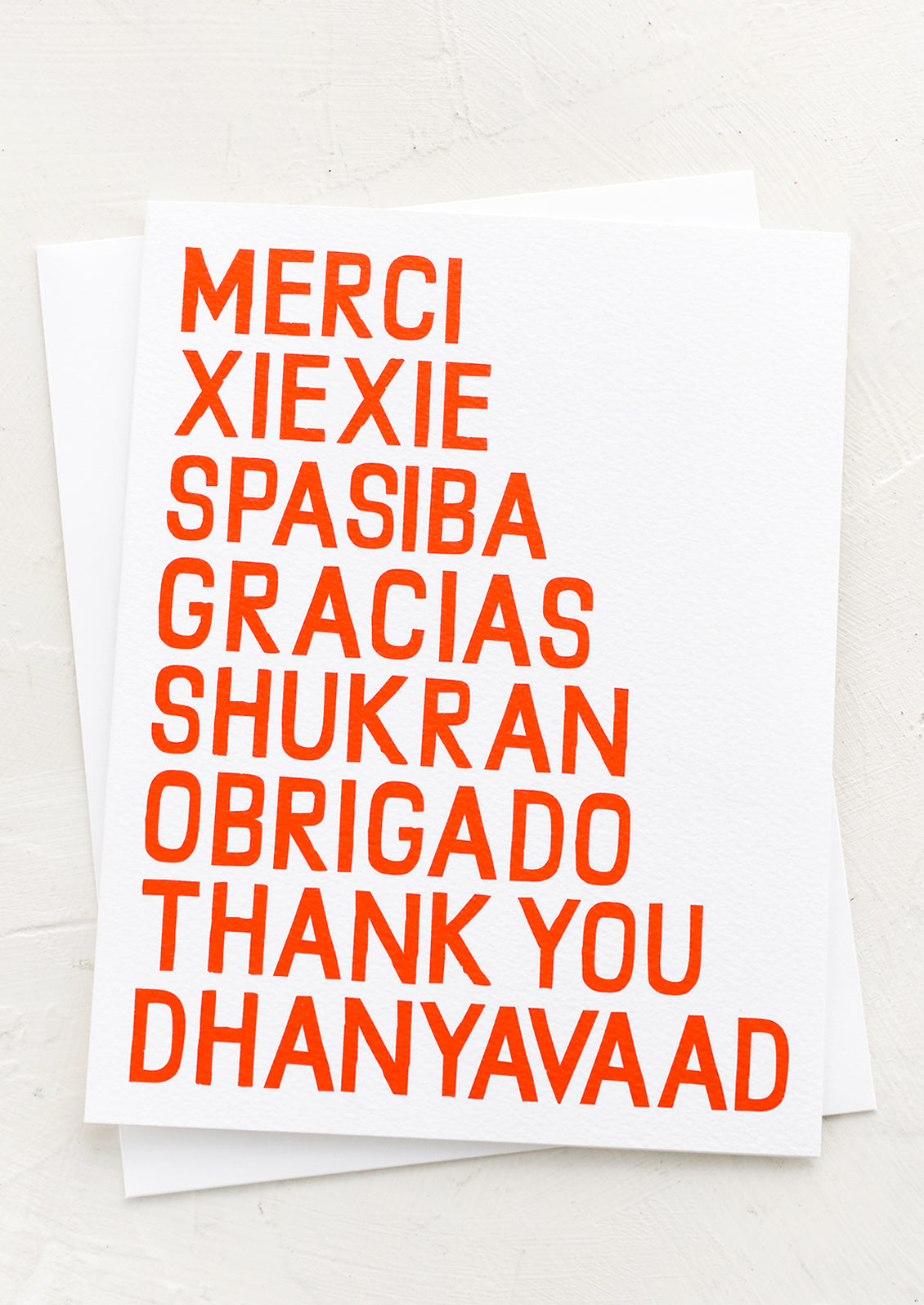 A thank you card with thank you written in different languages.