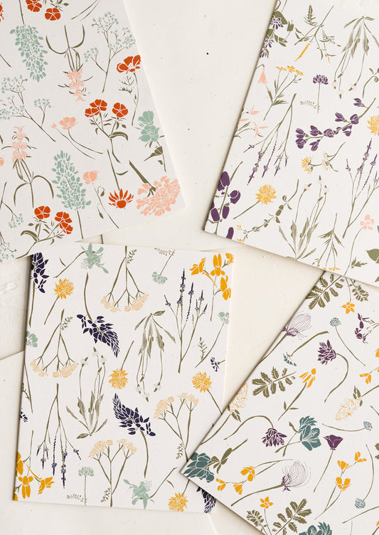 Four cards with wildflower patterns in slightly different designs and colors.