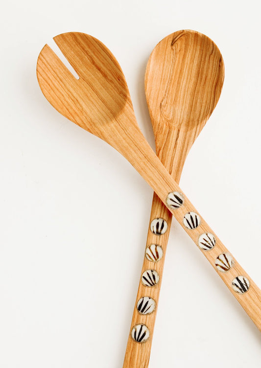 Pair of wooden salad serving spoons with round bone inlay detailing on handles