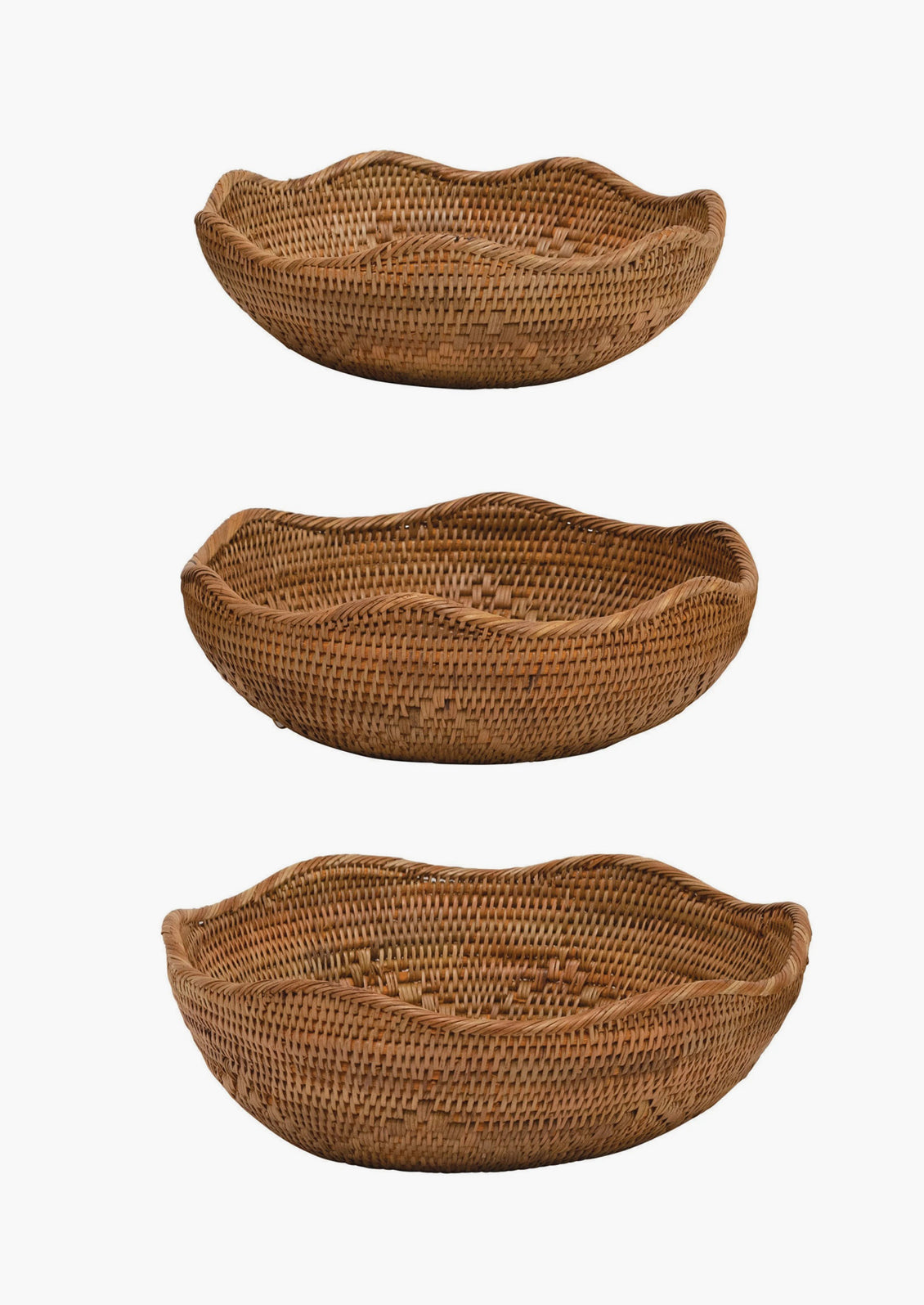 A brown woven shallow rattan basket with wavy edge.