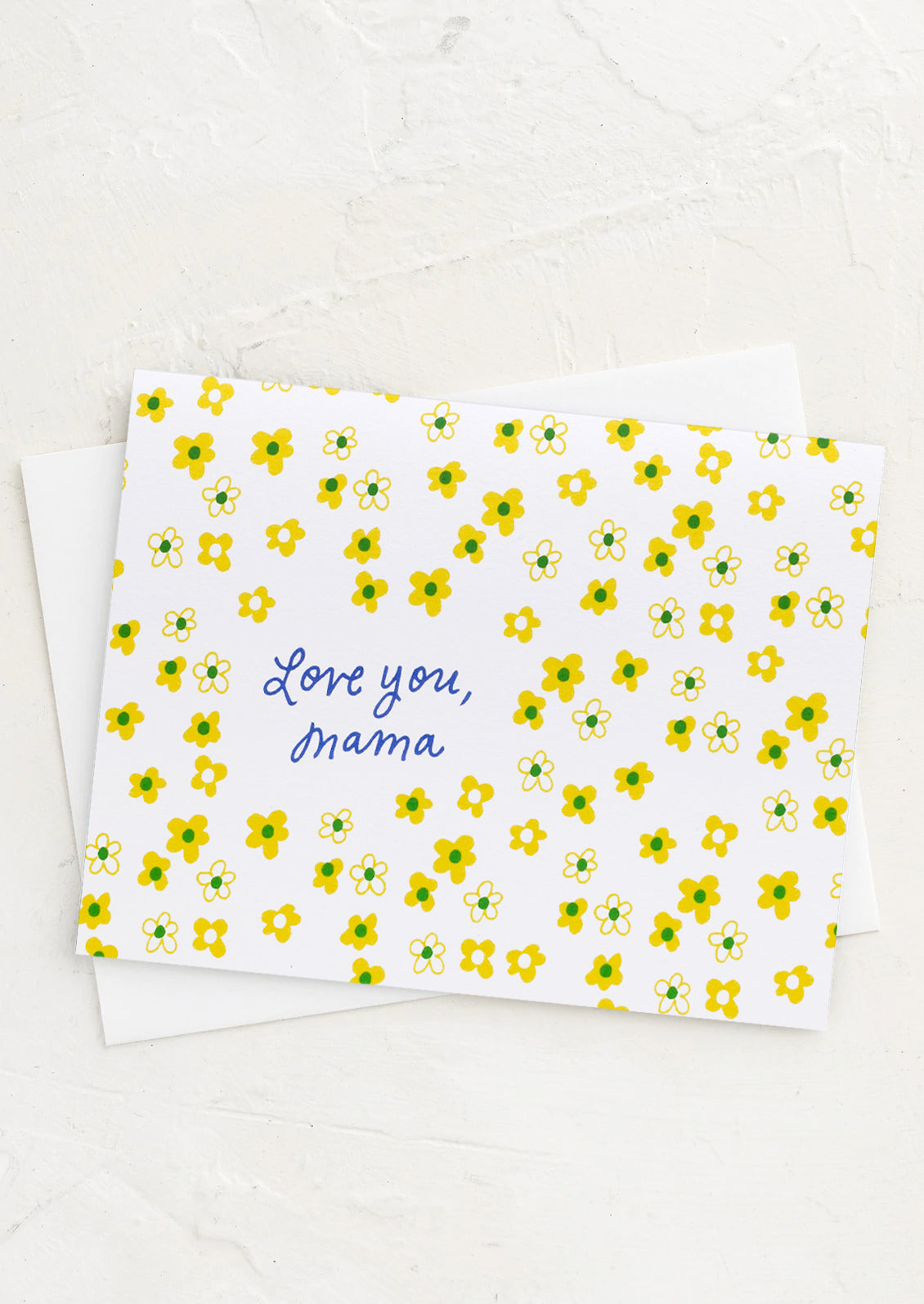 A greeting card with flower print reading "Love you, mama".