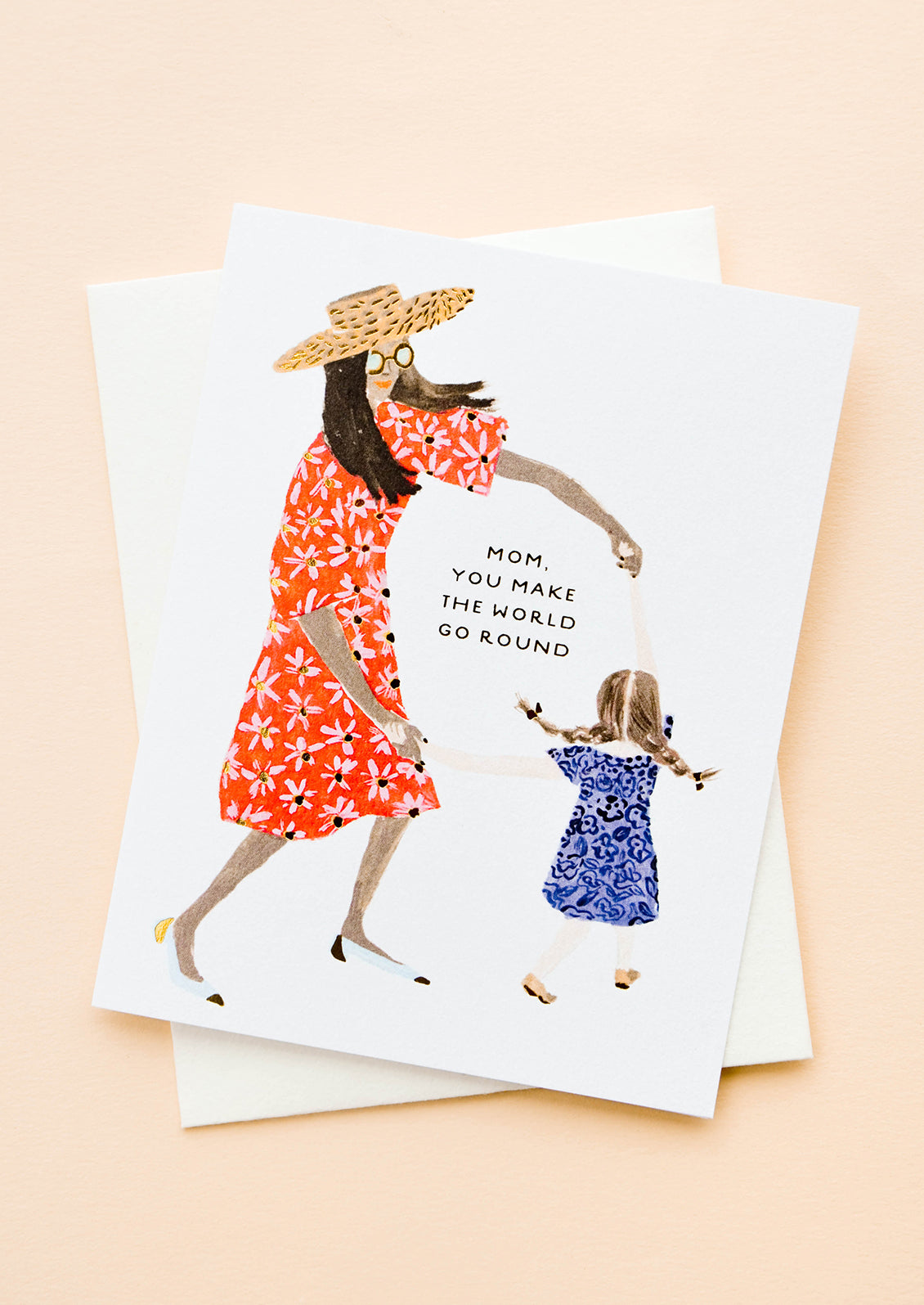 Greeting card picturing illustration of mother and child, text reading "Mom, You Make The World Go Round"