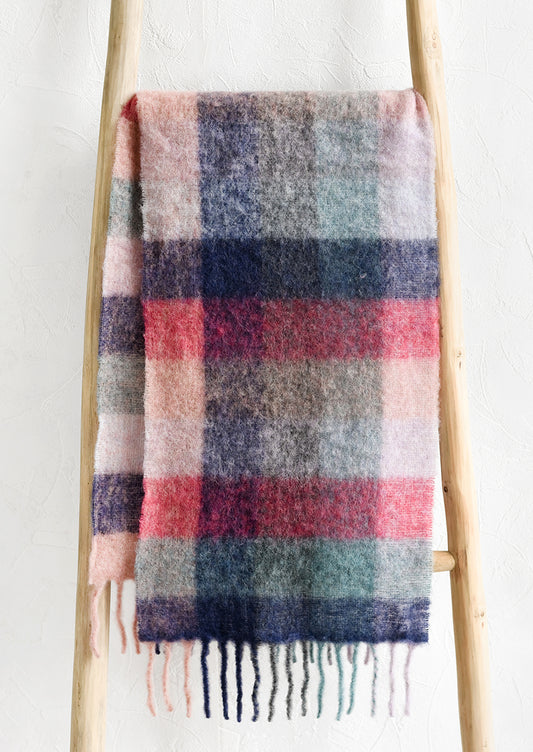 A fuzzy woven wool scarf in pastel madras pattern.