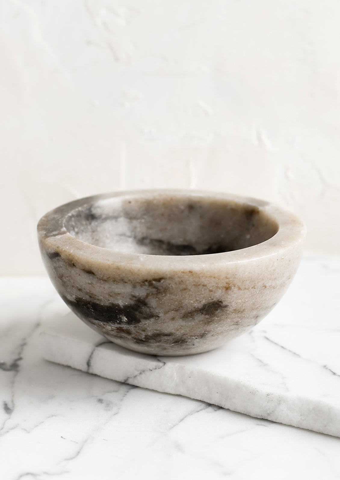 A small tan marble bowl.