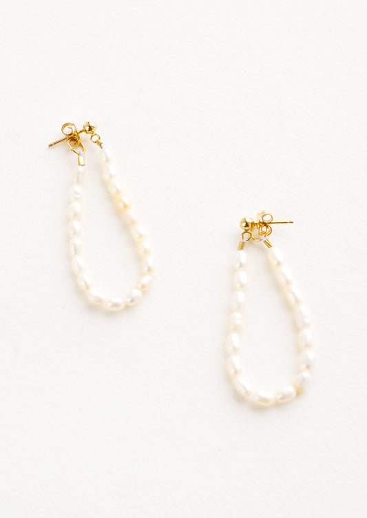 Pearl string earrings with two-sided post back closure that goes from the front to the back of the ear